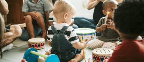 nursery children and teachers playing together