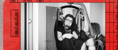 The author being moved in a hoist by a personal assistant.