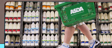 A shopper carrying a supermarket basket.