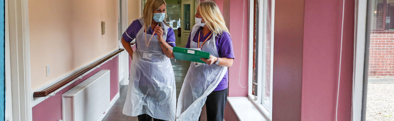 two care home workers wearing ppe