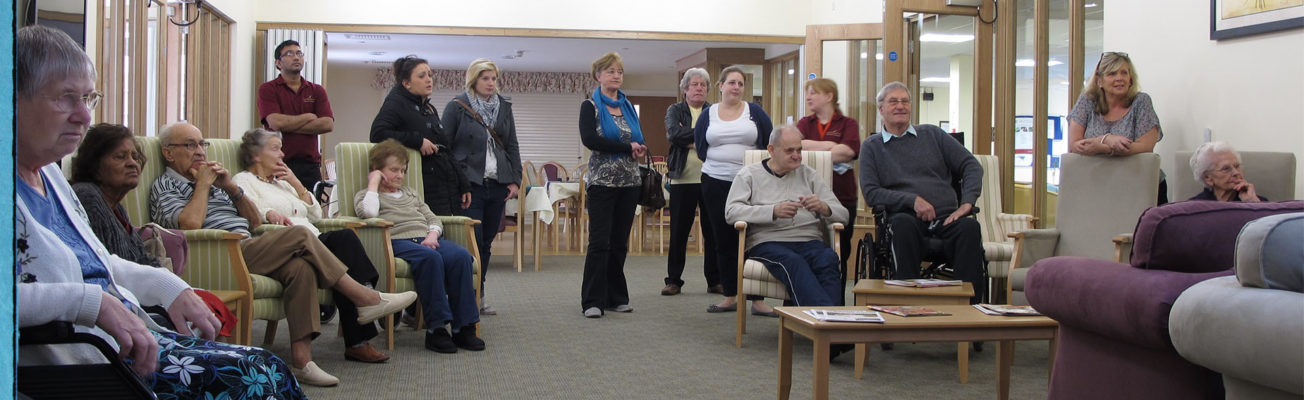 Residents and their families in an elderly care home.