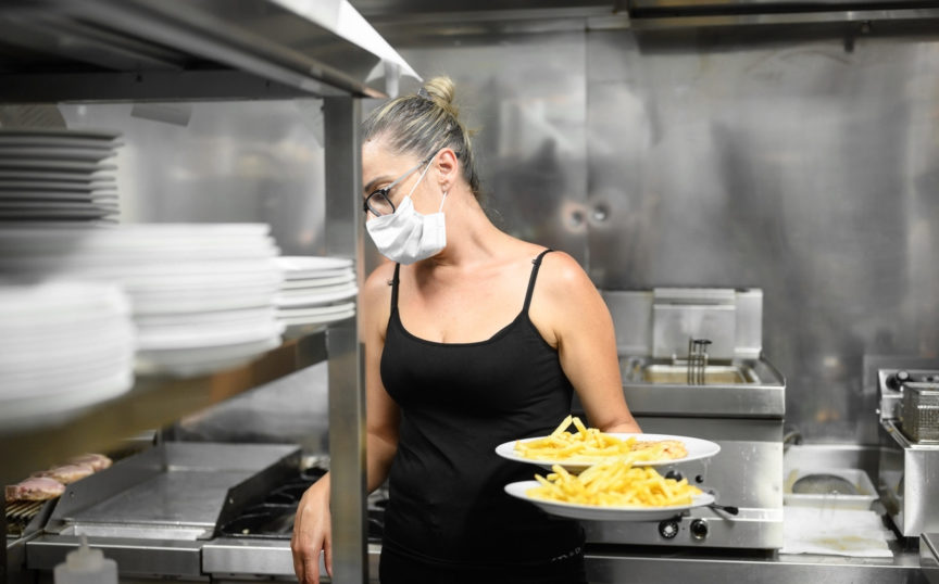 Waitress carrying chips