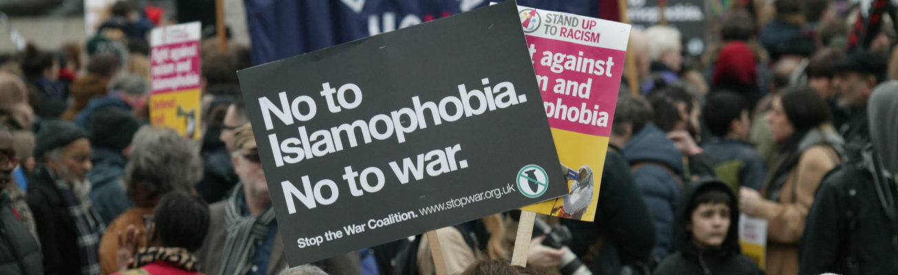 a protest at which someone holds the banner 'no to Islamophobia, no to war'