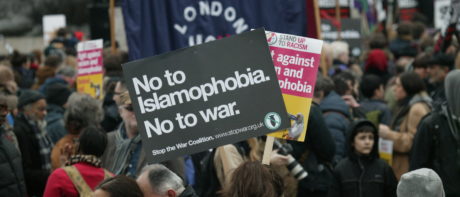 a protest at which someone holds the banner 'no to Islamophobia, no to war'