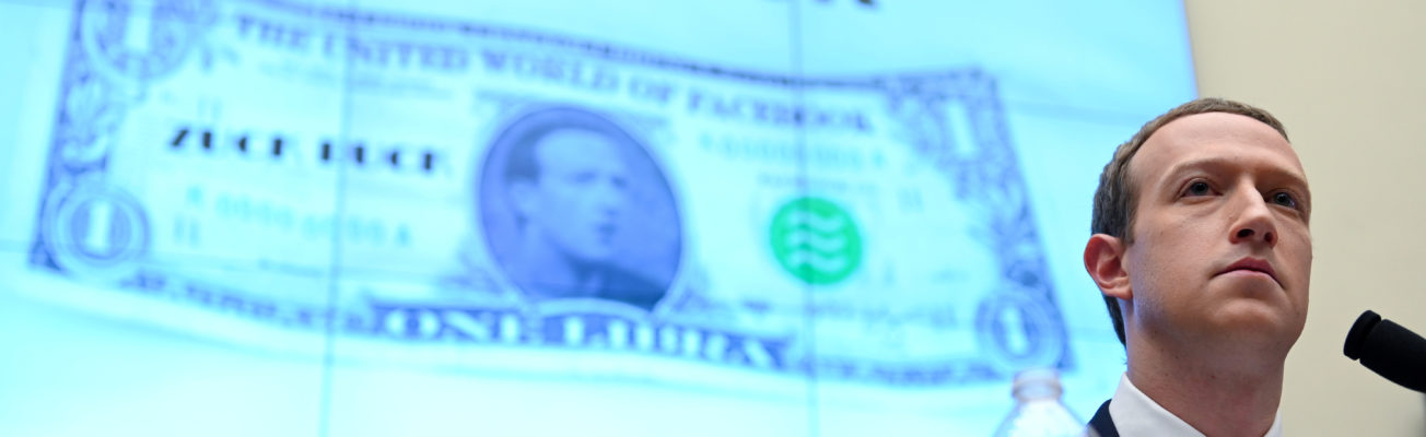 Mark Zuckerberg testifiesin front of a projected image of his face on a one-dollar note