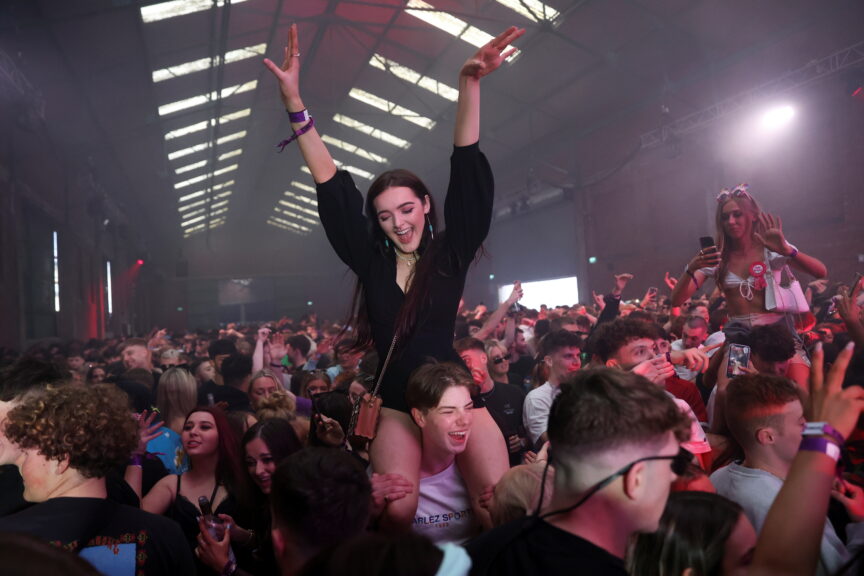 nightclub coronavirus pilot scheme girl with hands in the air partying clubs