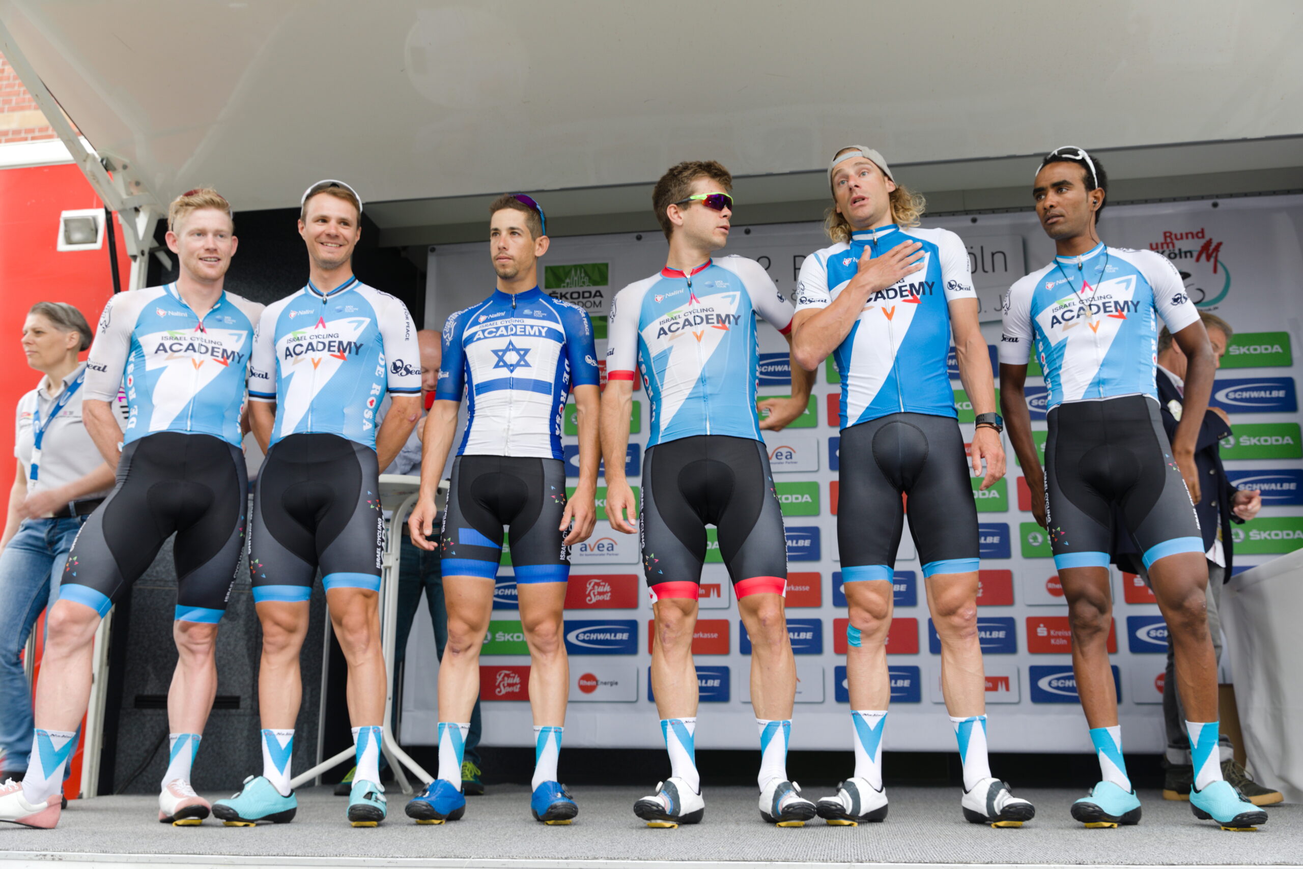 A group of cyclists signed with Israel Start-Up Nation (then Israel Cycling Academy) pose for a photo in their lycra in 2018