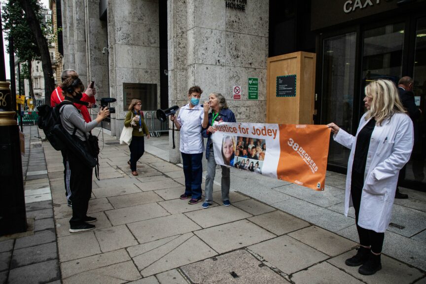 Activists for Jodey Whiting gather outside the DWP offices