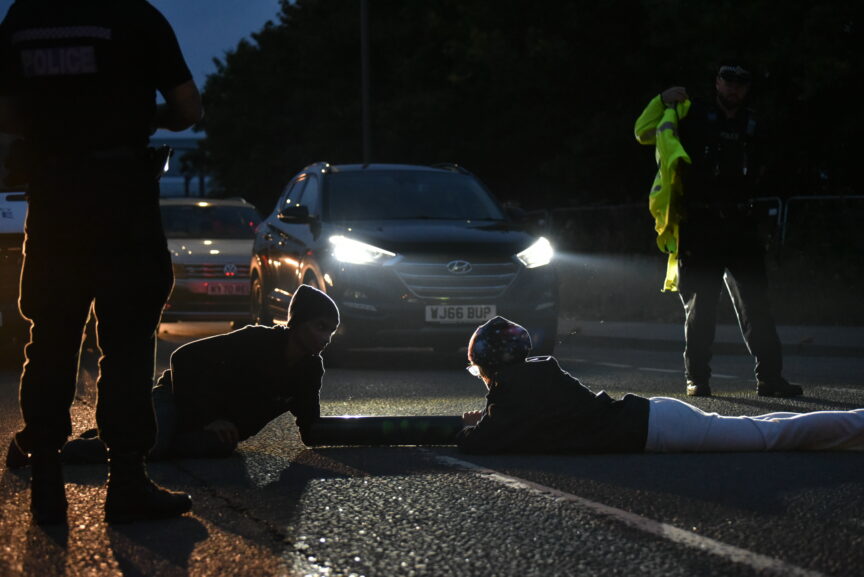 Animal Rebellion protesters block the road