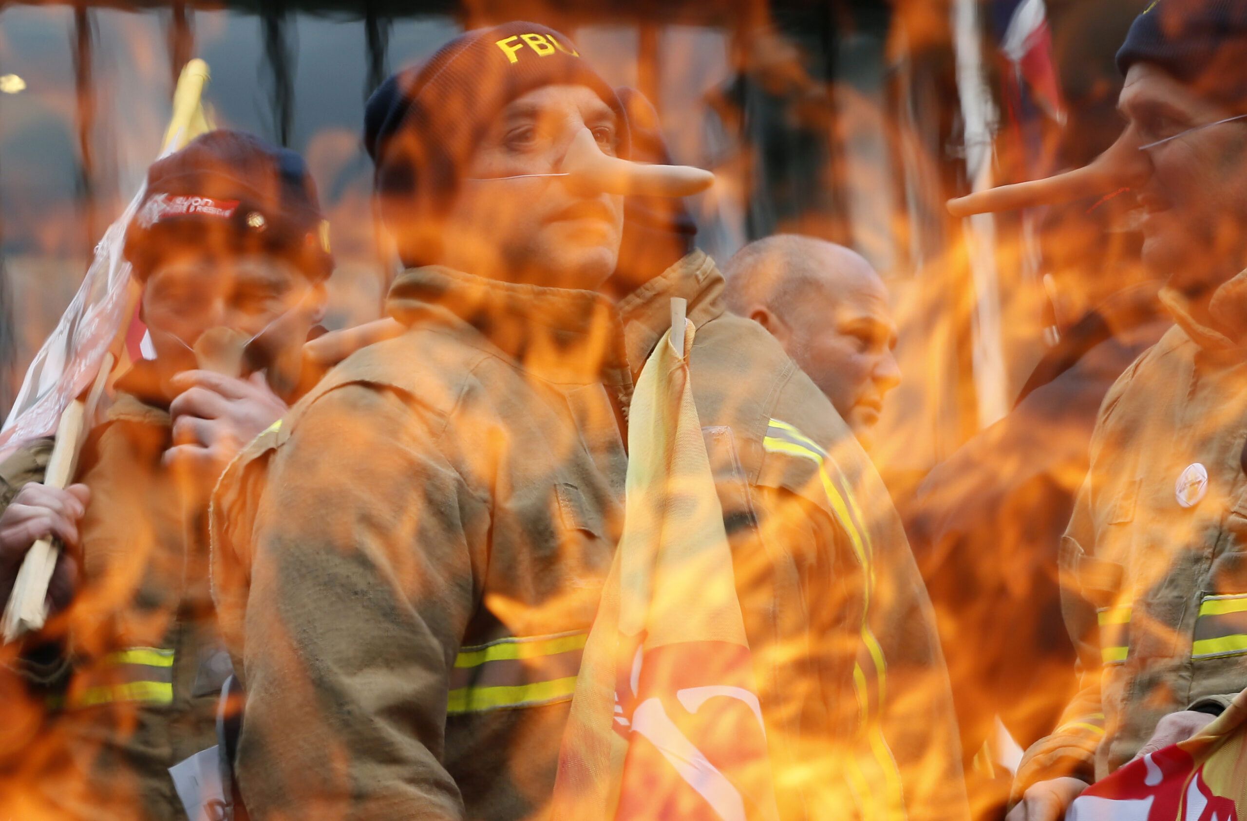 A striking firefighter by a brazier in 2015. REUTERS/Stefan Wermuth