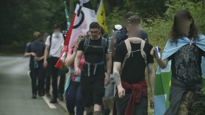 Patriotic Alternative leader Mark Collett on a walk with supporters. Photo: Red Flare