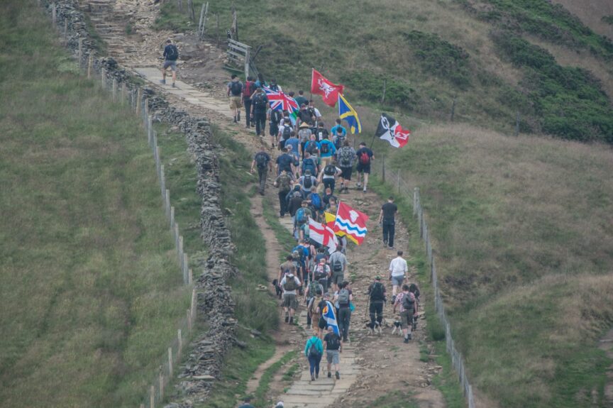 Patriotic Alternative supporters on a walk holding British regional and national flags. Photo: Red Flare