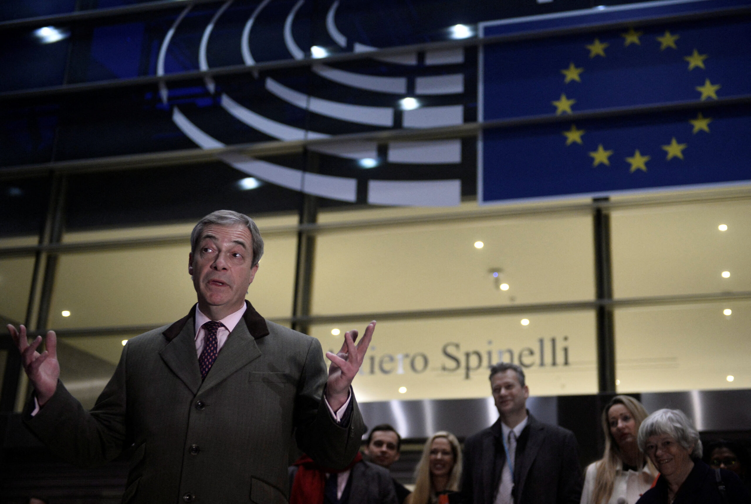 Brexit Party leader Nigel Farage speaks as he leaves the European Parliament