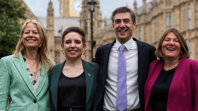 Carla Denyer (second from left) and Adrian Ramsay (third from left), co-leaders of the Greens. Claudia Greco/Reuters