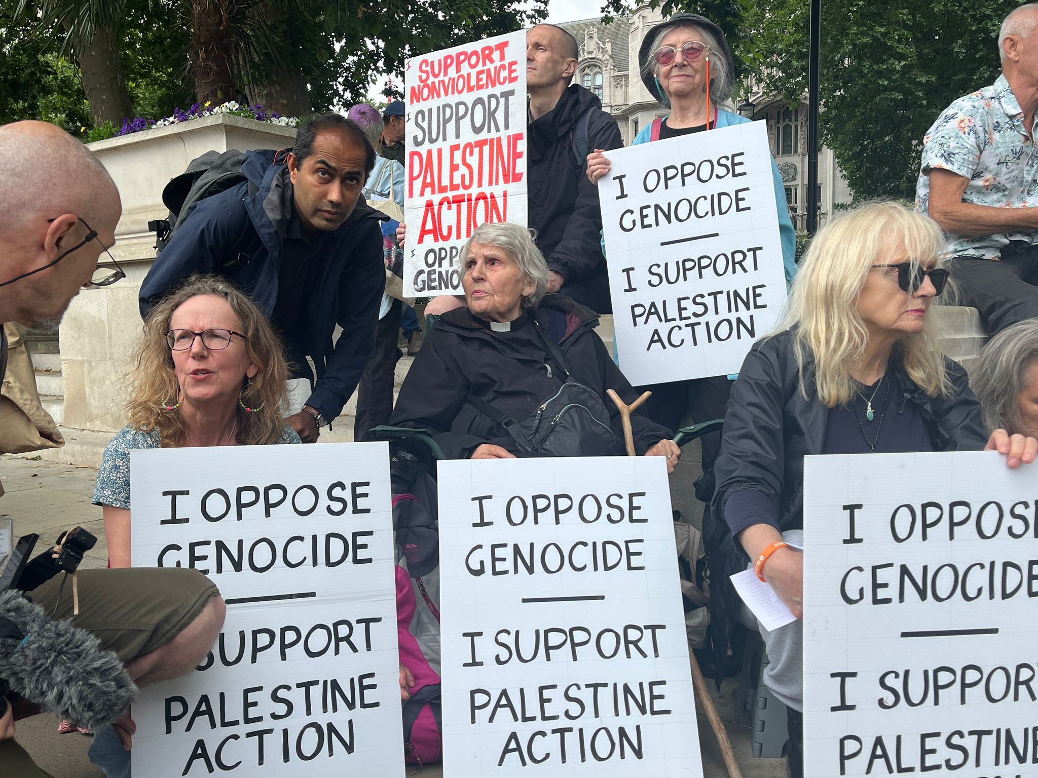Protesters from defend juries with signs