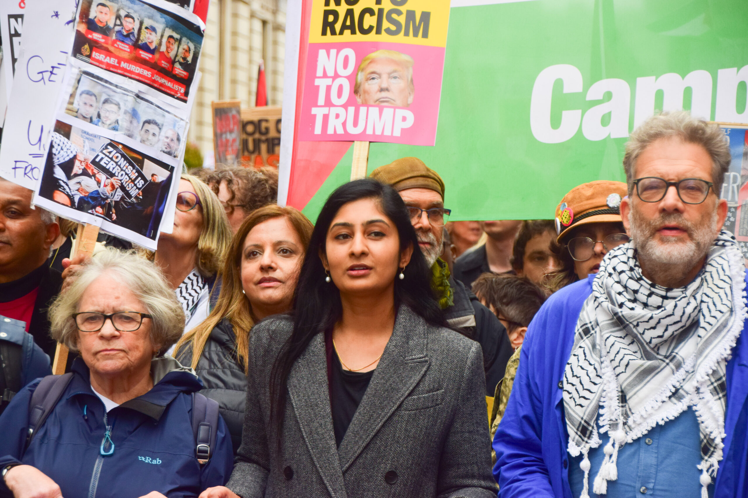 A woman leads a march alongside activists