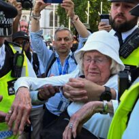 Police officers detain an 89-year-old protester, named La, during a rally organised by Defend Our Juries, challenging the British government's proscription of Palestine Action under anti-terrorism laws, in Parliament Square, London on 9 August 2025. Jaimi Joy/Reuters