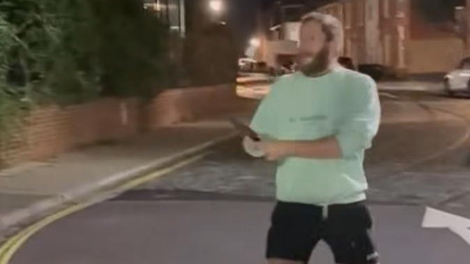 A man holding a knife in a racist attack