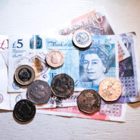 British Pound sterling bank notes and coins. Alberto Pezzali/NurPhoto/Reuters
