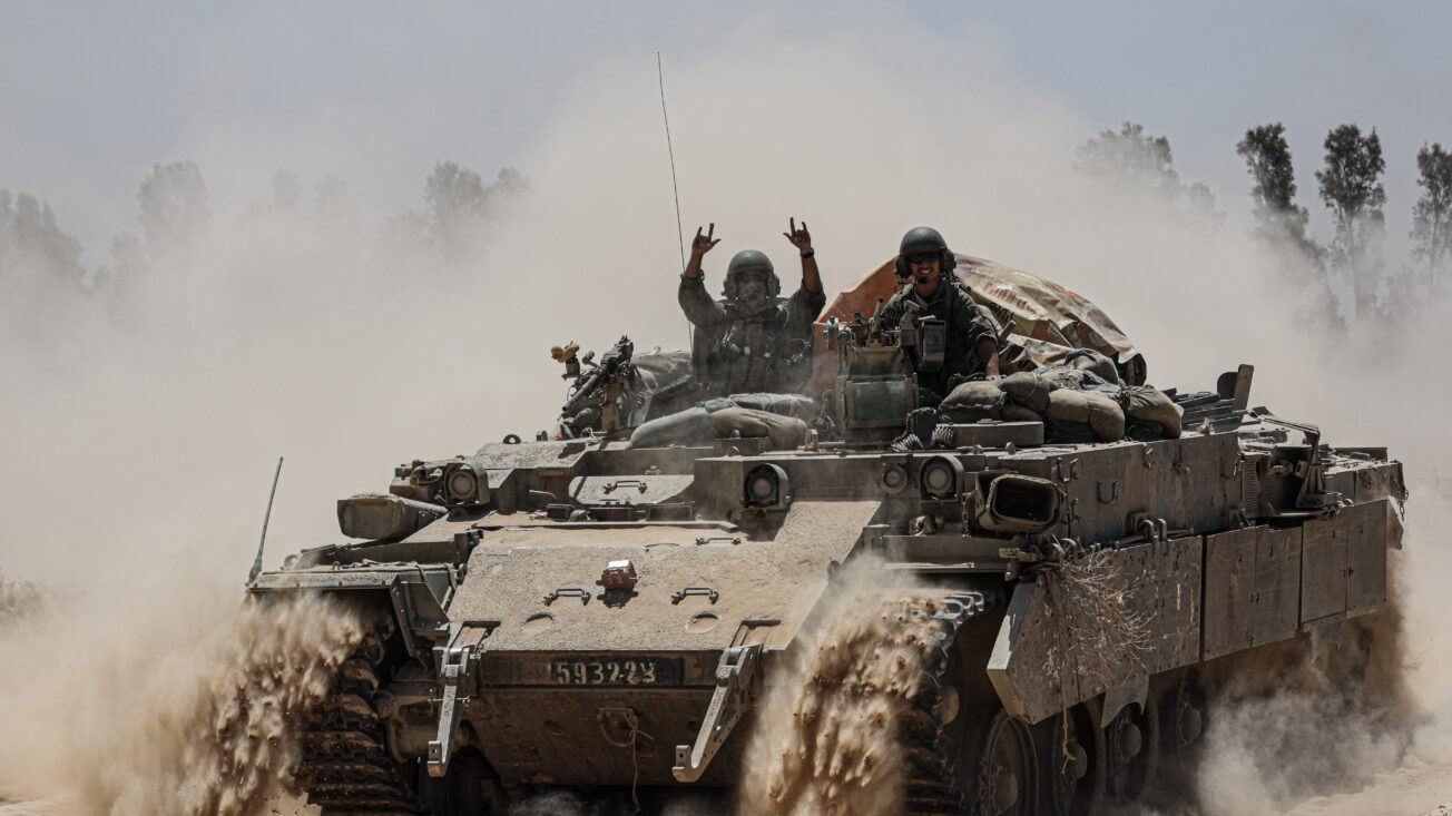 An Israeli army tank deploys at Israel’s southern border with the Gaza Strip. Saeed Qaq/ZUMA Press Wire/Reuters