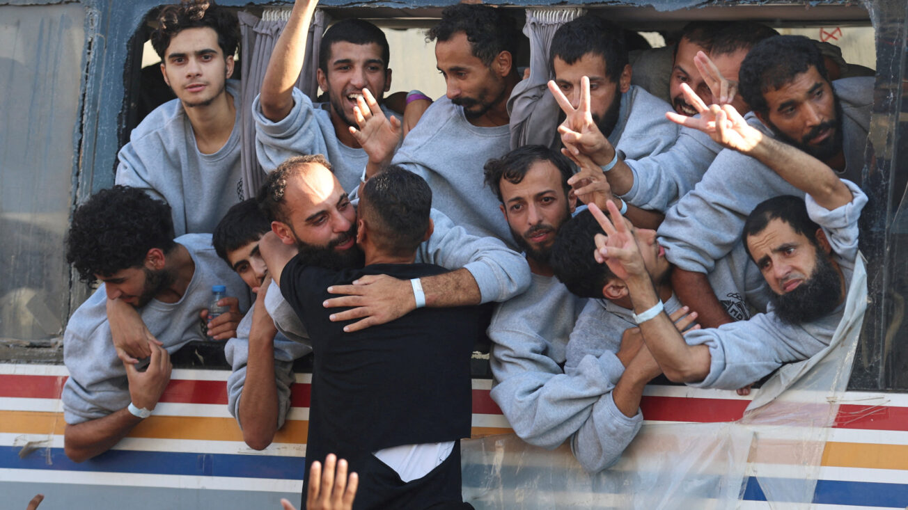 Freed Palestinian prisoners released by Israel as part of a hostages-prisoners swap and a ceasefire deal between Hamas and Israel, gesture, in Khan Younis in the southern Gaza Strip, October 13, 2025.