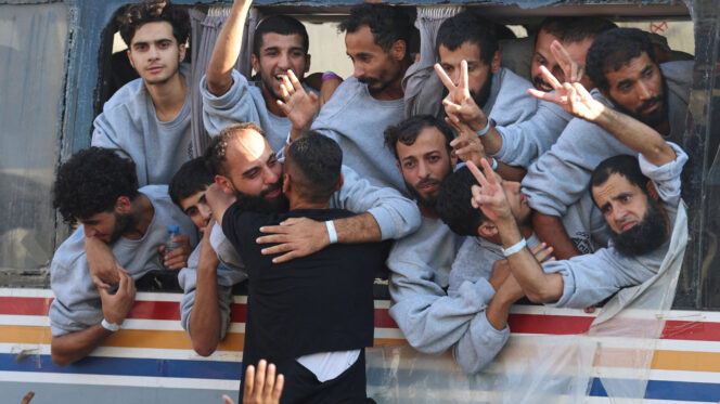 Freed Palestinian prisoners released by Israel as part of a hostages-prisoners swap and a ceasefire deal between Hamas and Israel, gesture, in Khan Younis in the southern Gaza Strip, October 13, 2025.