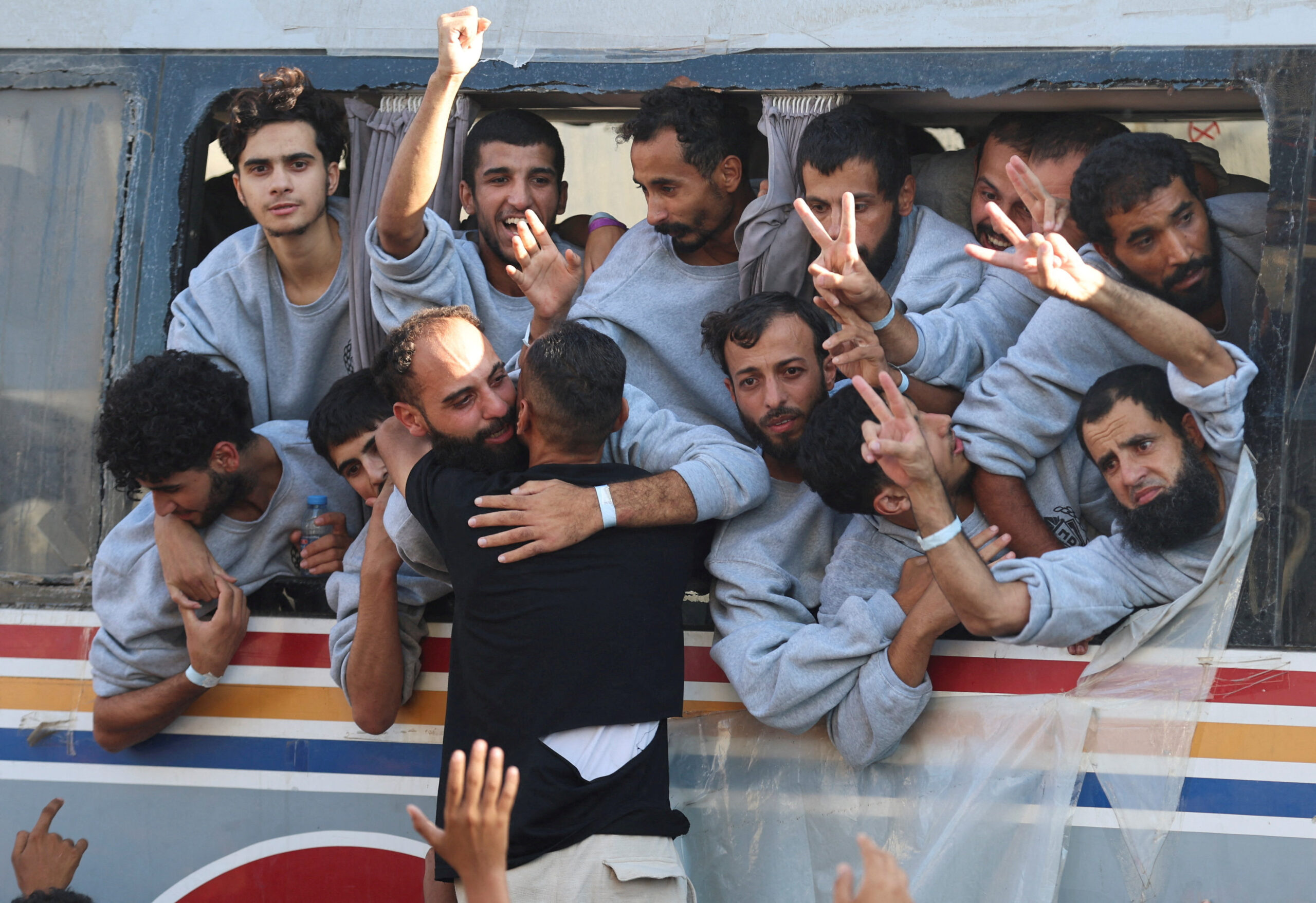 Freed Palestinian prisoners released by Israel as part of a hostages-prisoners swap and a ceasefire deal between Hamas and Israel, gesture, in Khan Younis in the southern Gaza Strip, October 13, 2025.