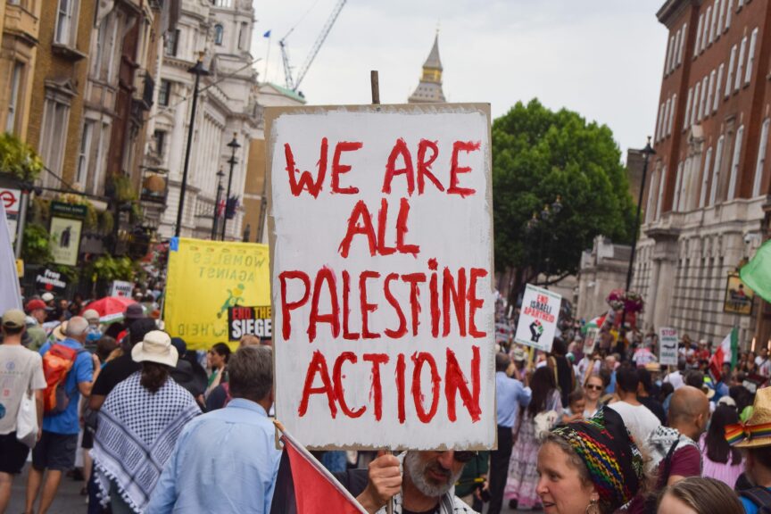 A protester holds a placard in support of the activist group Palestine Action during a demonstration in Whitehall, London, UK on 21 June 2025. SOPA Images Limited/Alamy Live News