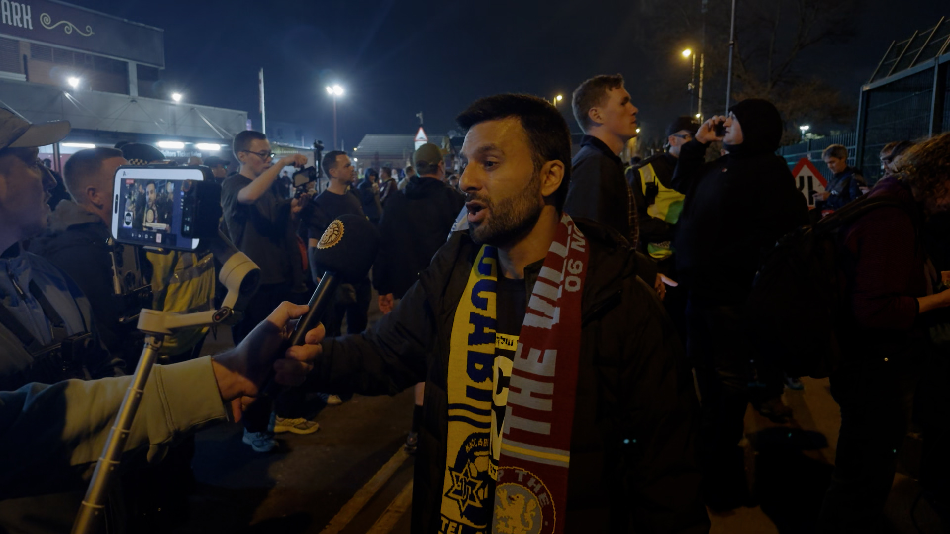A football fan wearing a joint Aston Villa-Maccabi Tel Aviv scarf at the Villa Park match in Birmingham on Thursday 6 November 2025. Jonah Sealey Braverman/Novara Media