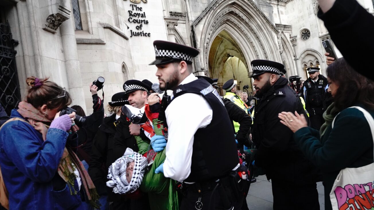 Police arrest a protester in London as the Judicial Review challenging the proscription of Palestine Action gets underway in November. Photo: Joao Daniel Pereira/Sipa USA