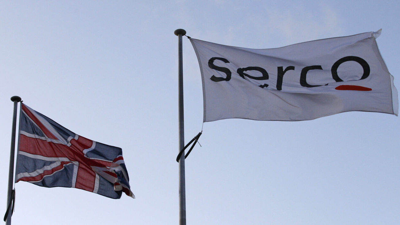 Two flags, one union jack, one says "Serco".