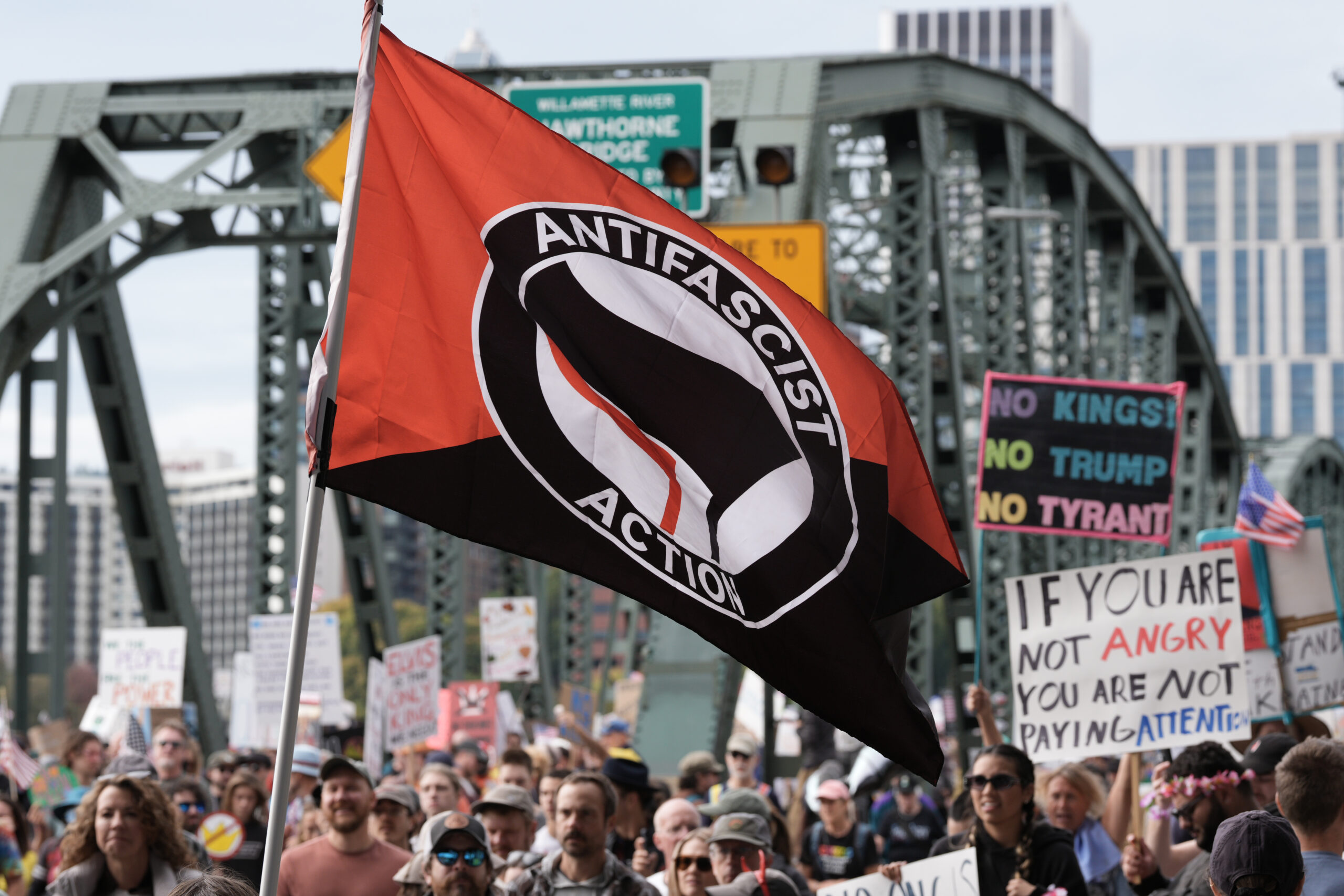 An antifascist action flag is displayed as protesters take part in the nationwide No Kings protest against the authoritarian policies of President Trump in Portland, Oregon on 18 October 2025. (Alex Milan Tracy/Sipa USA)