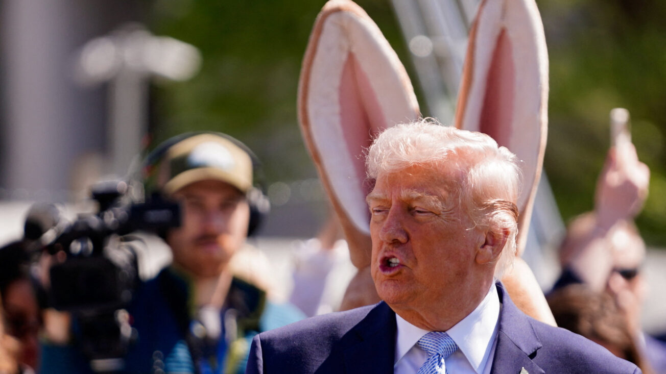 Donald Trump with rabbit ears behind him