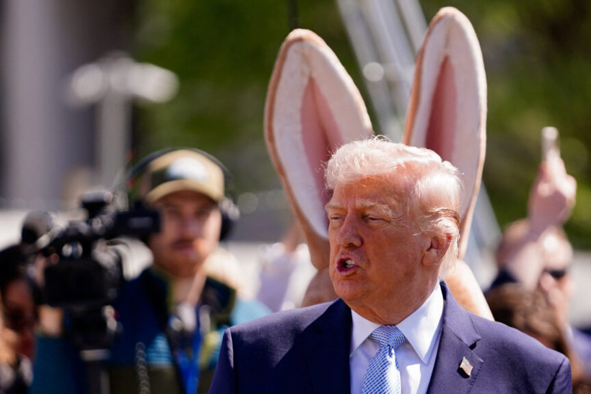 Donald Trump with rabbit ears behind him