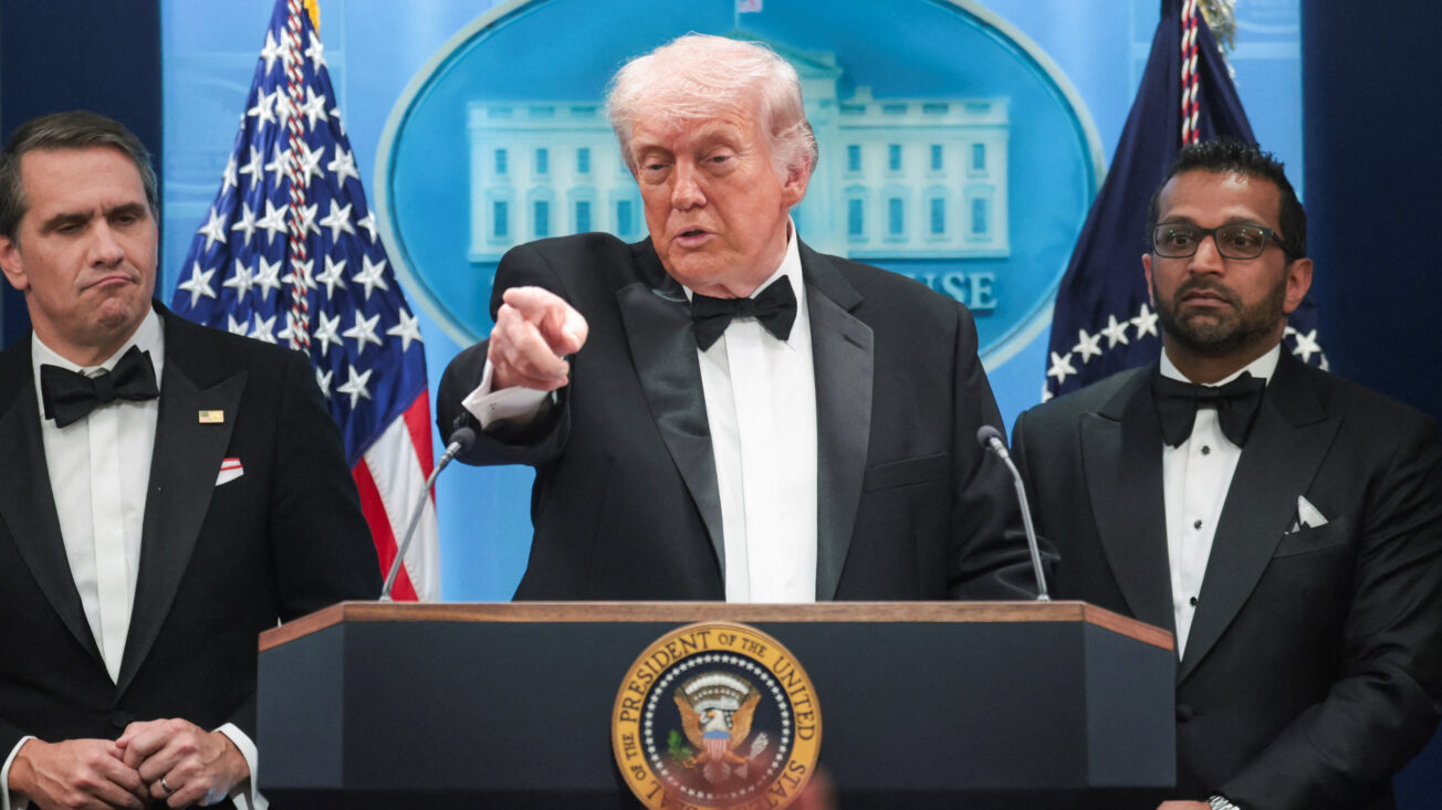 Trump pointing to reporters for questions at a press conference