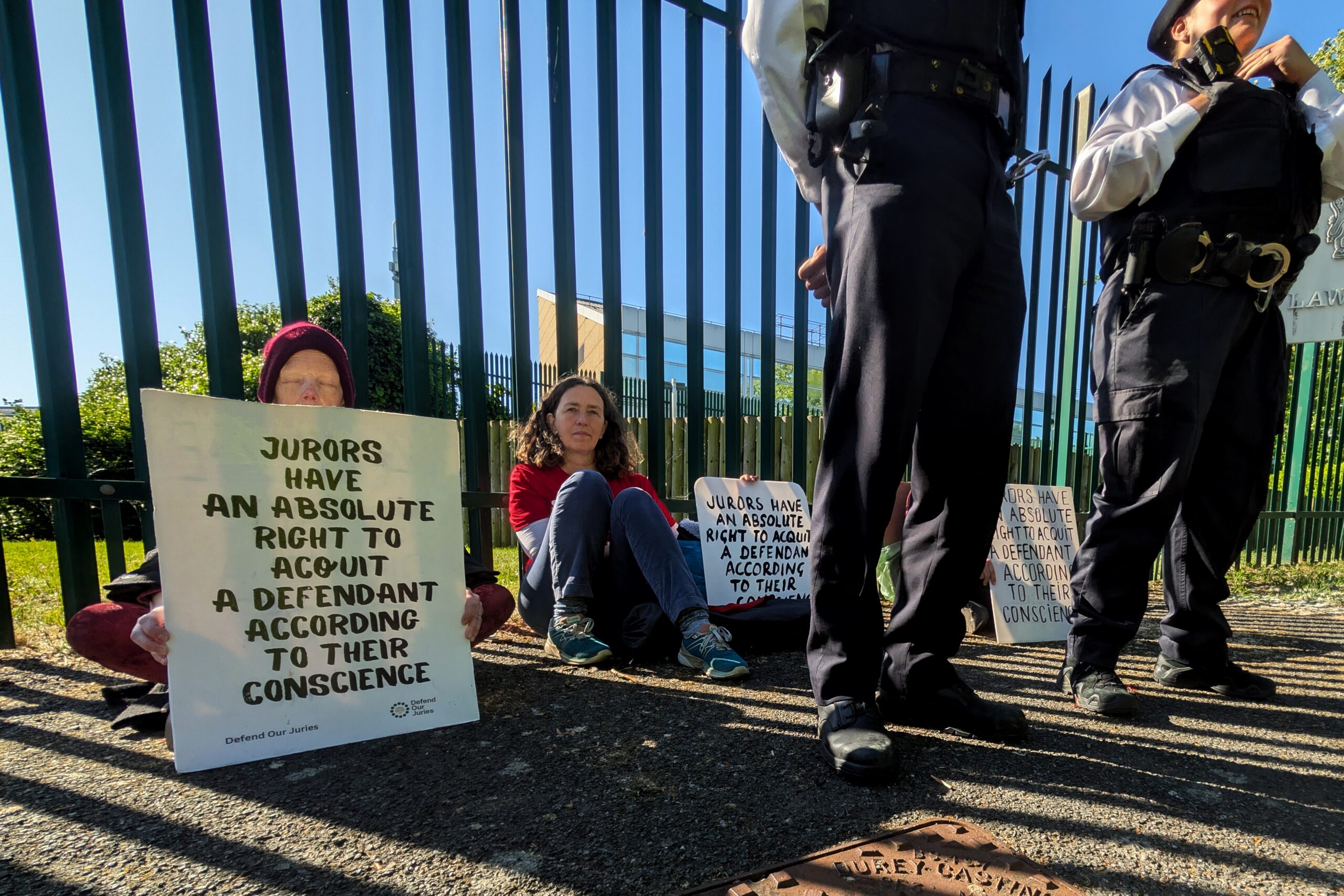 Protesters outside Woolwich Crown Court hold signs reminding jurors of their right to acquit according to their conscience. Photo: Defend Our Juries