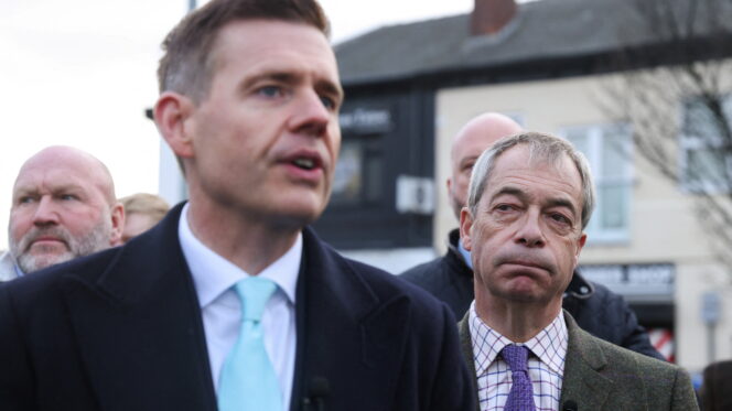 Matt Goodwin with Reform leader Nigel Farage on the campaign trail in Gorton and Denton in January. Photo: Reuters/Temilade Adelaja