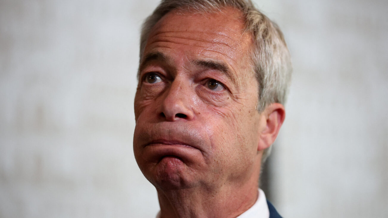 Nigel Farage looks on as he meets with newly elected Reform UK candidates at a bar in St Helens, Merseyside. Photo: Reuters/Phil Noble