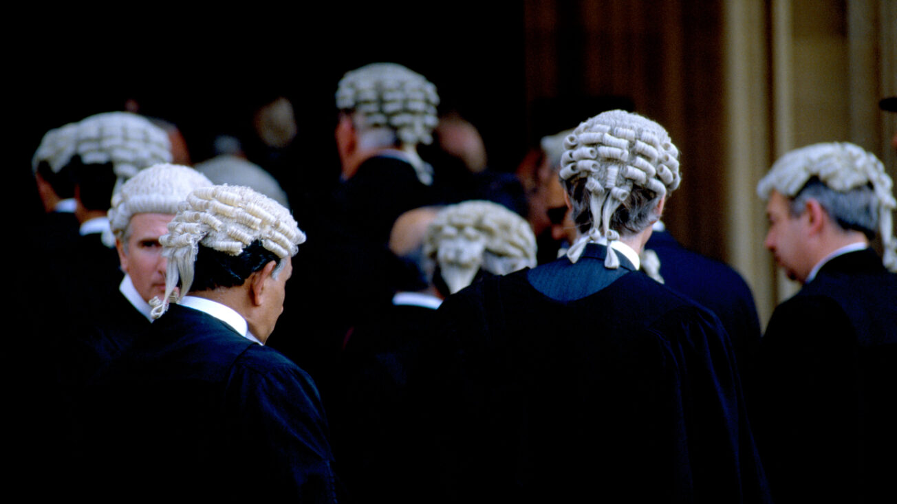 A stock photo of barristers wearing wigs and gowns