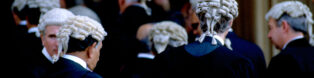 A stock photo of barristers wearing wigs and gowns