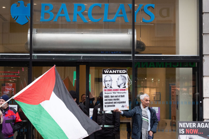 Palestine Solidarity Campaign activists protest outside of a branch of Barclays Bank in Glasgow in December 2025. Photo: Cameron Scott/ZUMA Press Wire