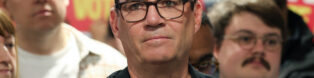 Dark-haired man with glasses