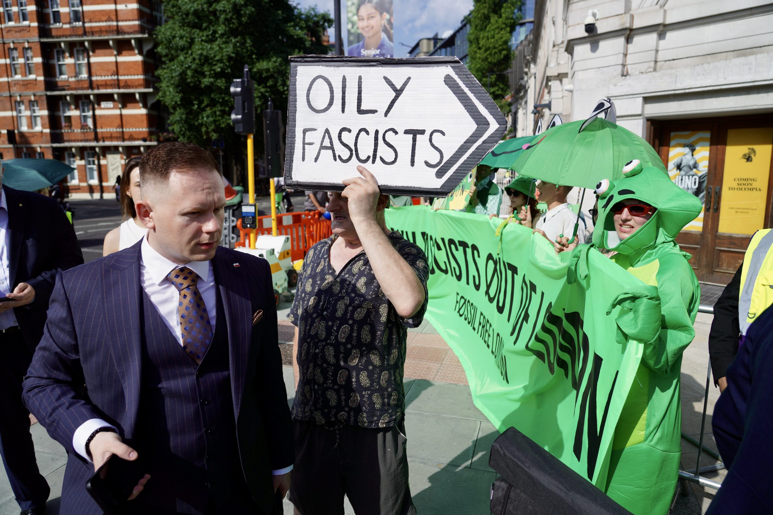 An attendee at the Arc conference makes his way through environmental protesters. Photo: Fossil Free London