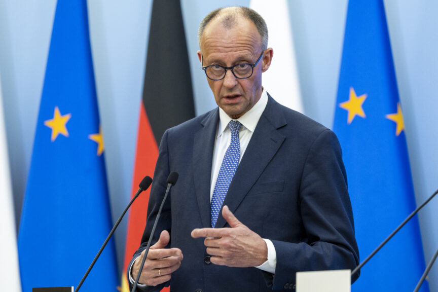 German chancellor Friedrich Merz in front of flags
