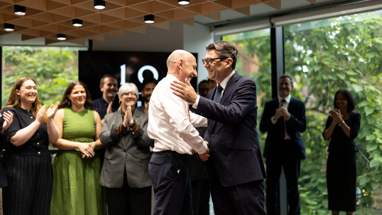 two white men shake hands