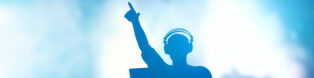 Club, disco DJ playing and mixing music for people.