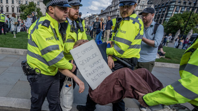 police carry a protester away