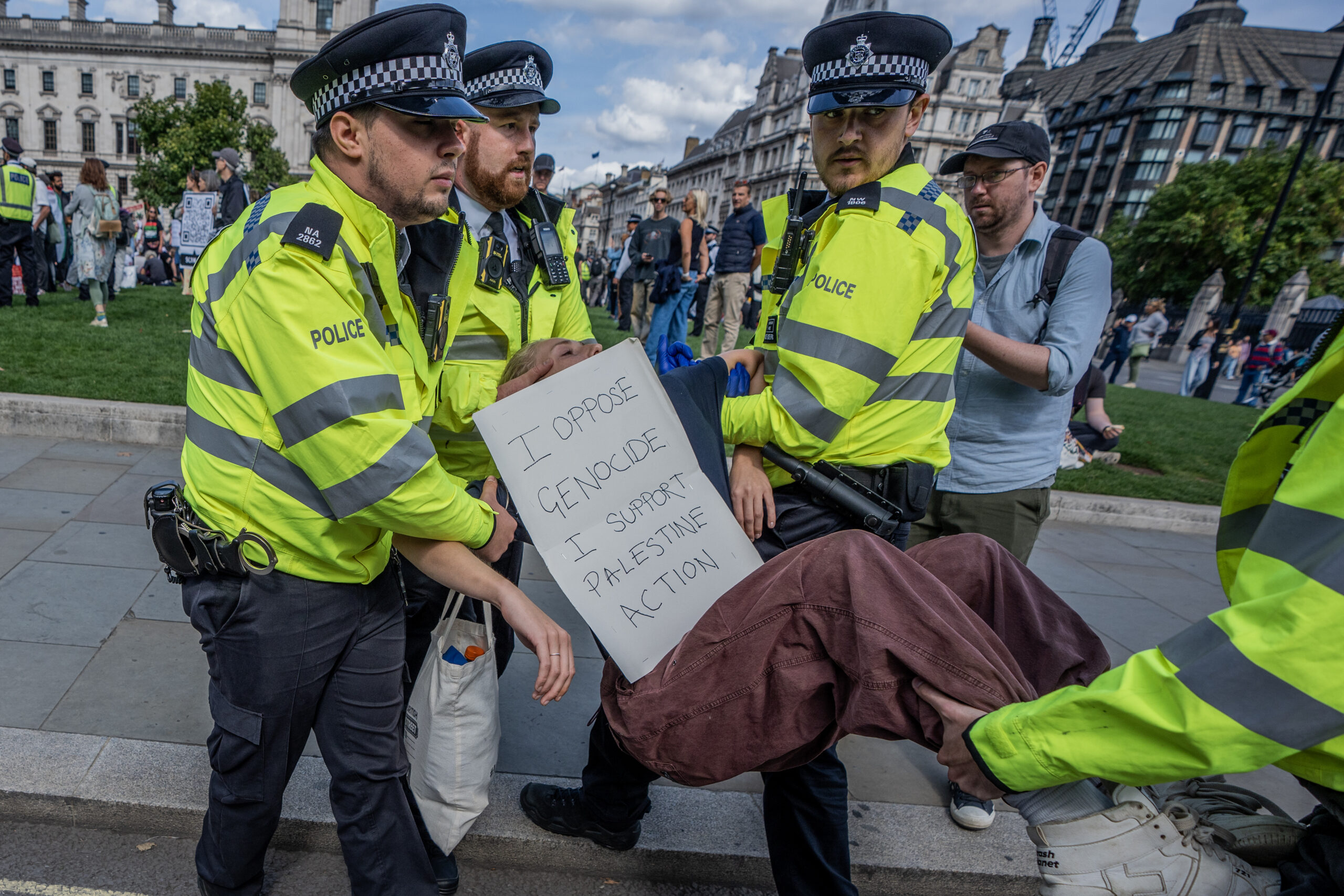 police carry a protester away